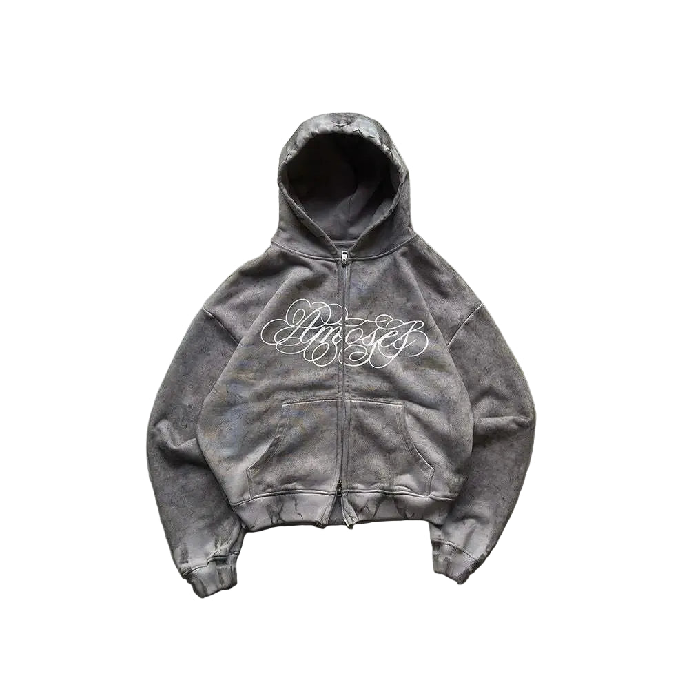 Gray hoodie with 'Lifecycles' text on a textured surface with ivy