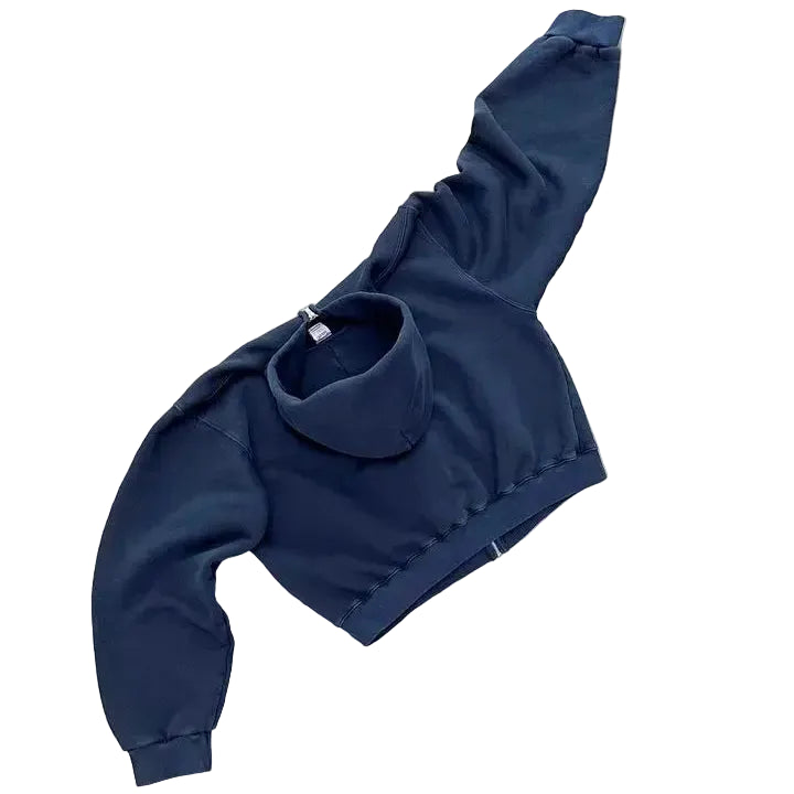 Navy blue hoodie on a gray concrete surface