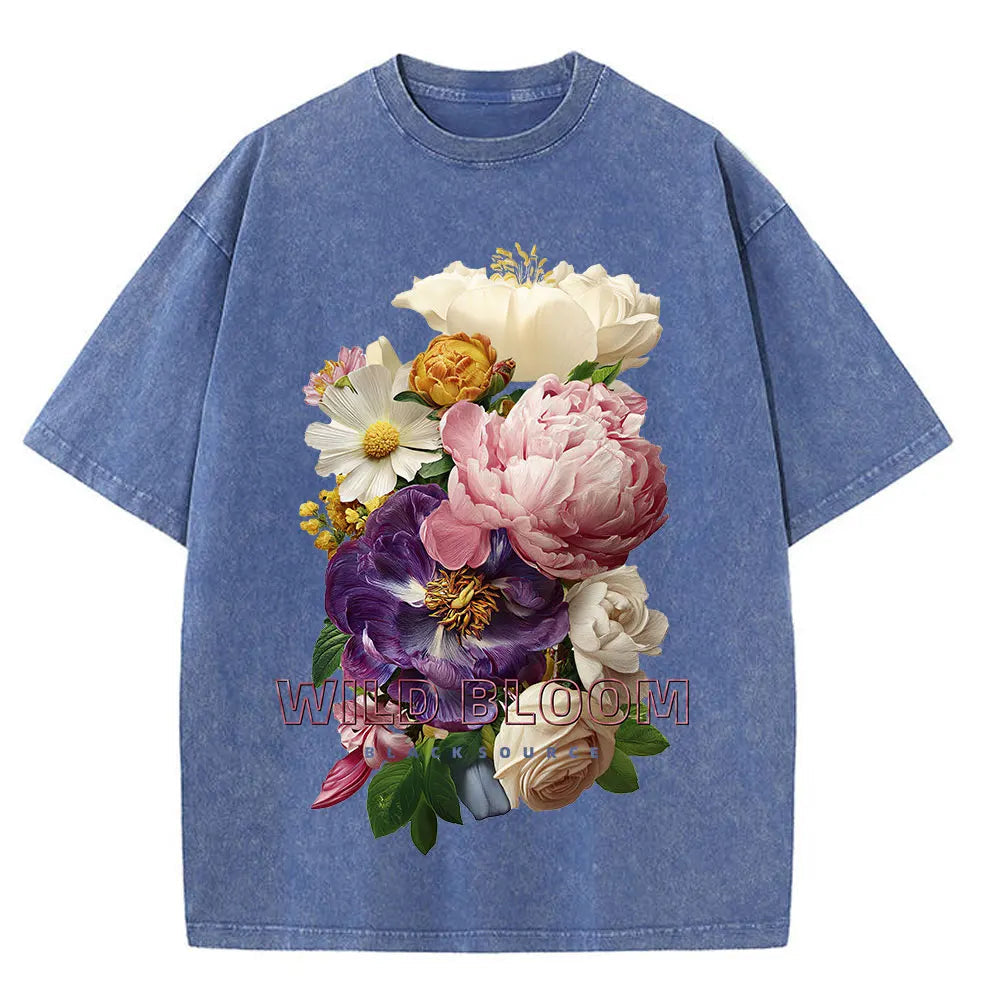 Blue t-shirt with a colorful floral design on a white background