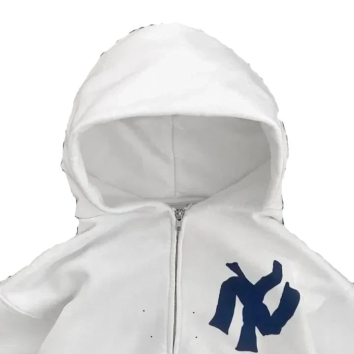 White hoodie with a blue logo on a gray background