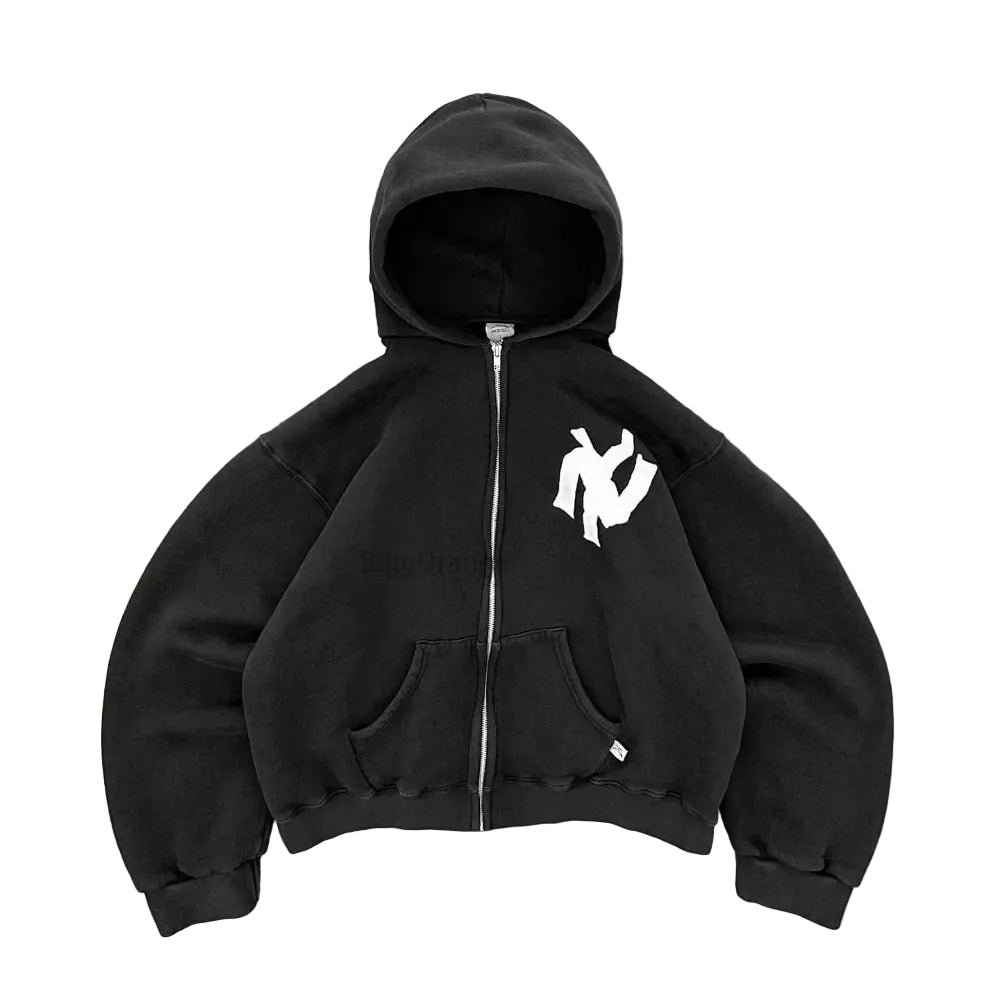Black hoodie with a white logo on a gray surface