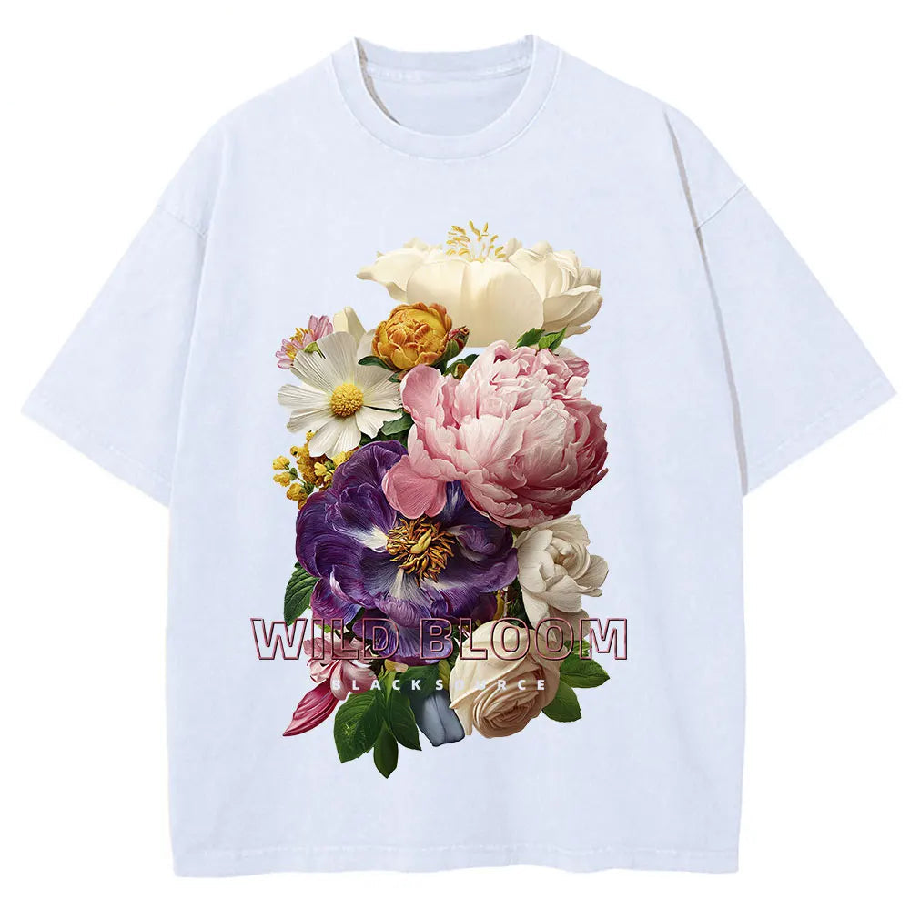 White t-shirt with colorful floral design on a white background