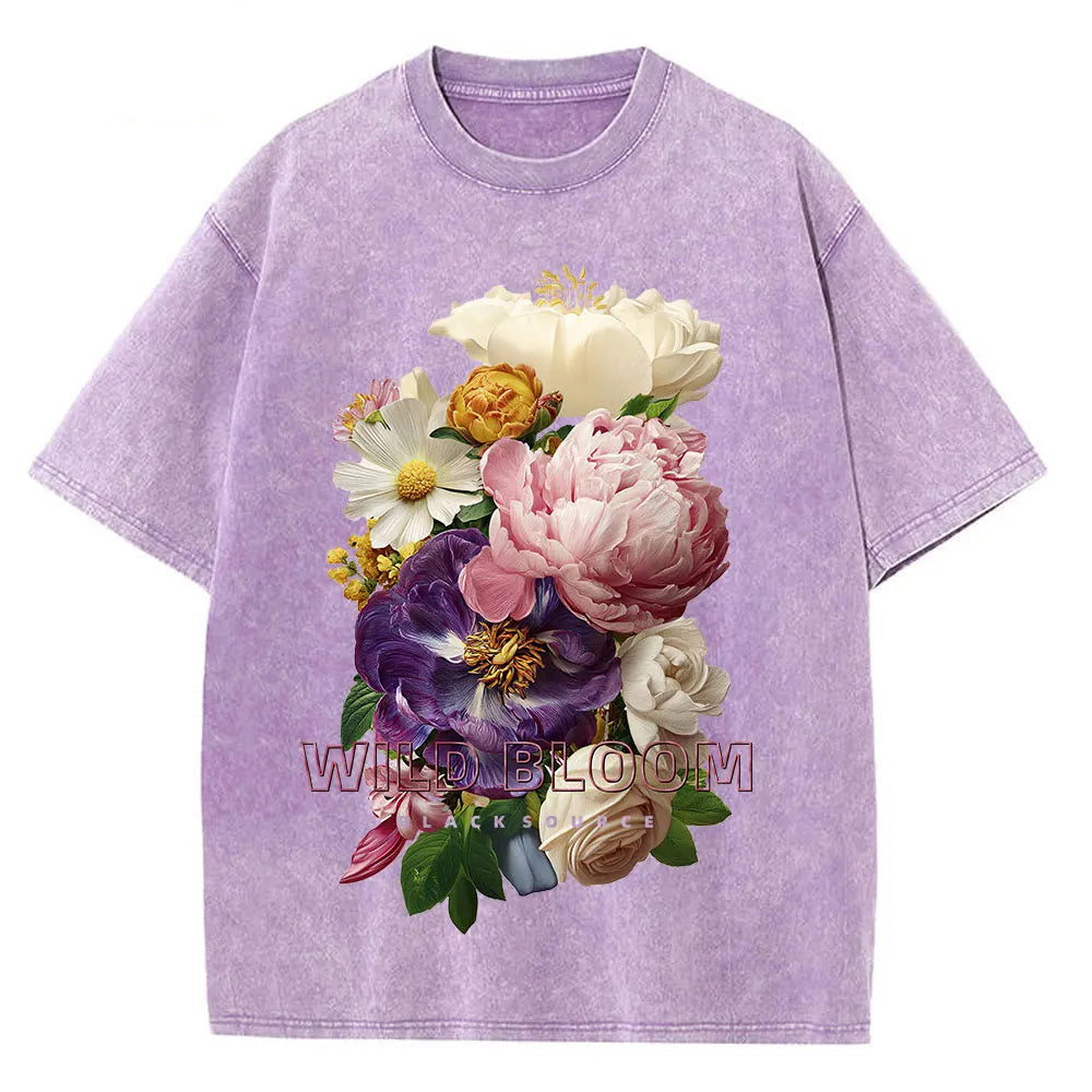 Purple t-shirt with a colorful floral design on a white background