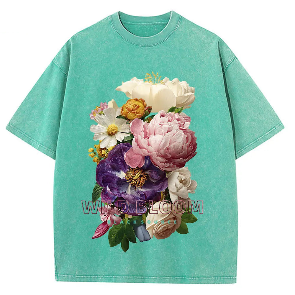 Green t-shirt with a colorful floral design on a white background