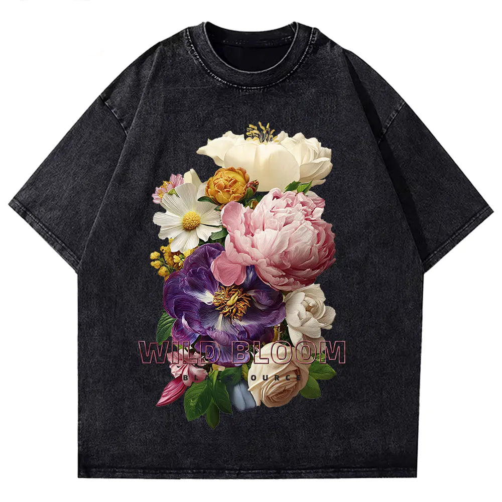 Black t-shirt with colorful floral design on a white background