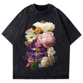 Black t-shirt with colorful floral design on a white background