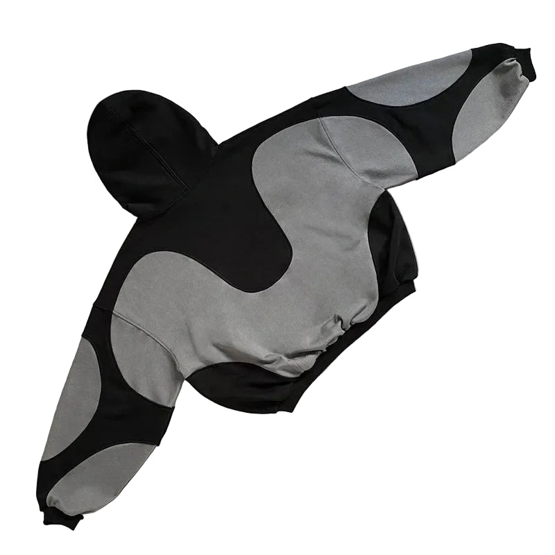 Black and gray patterned jacket on a textured surface