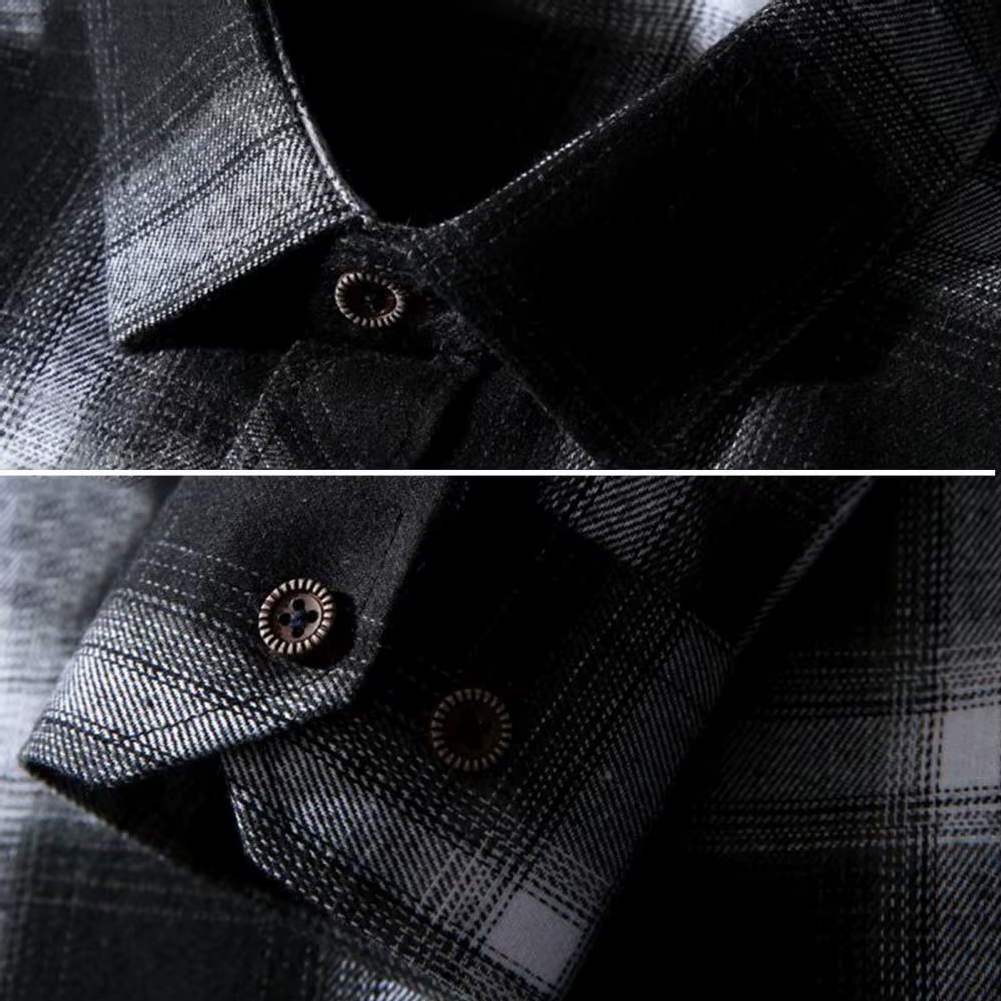Close-up of a black and gray plaid shirt with button details.