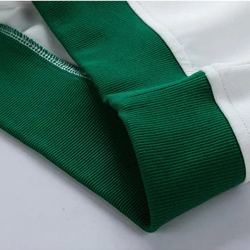 Close-up of green and white fabric with text on a gray background