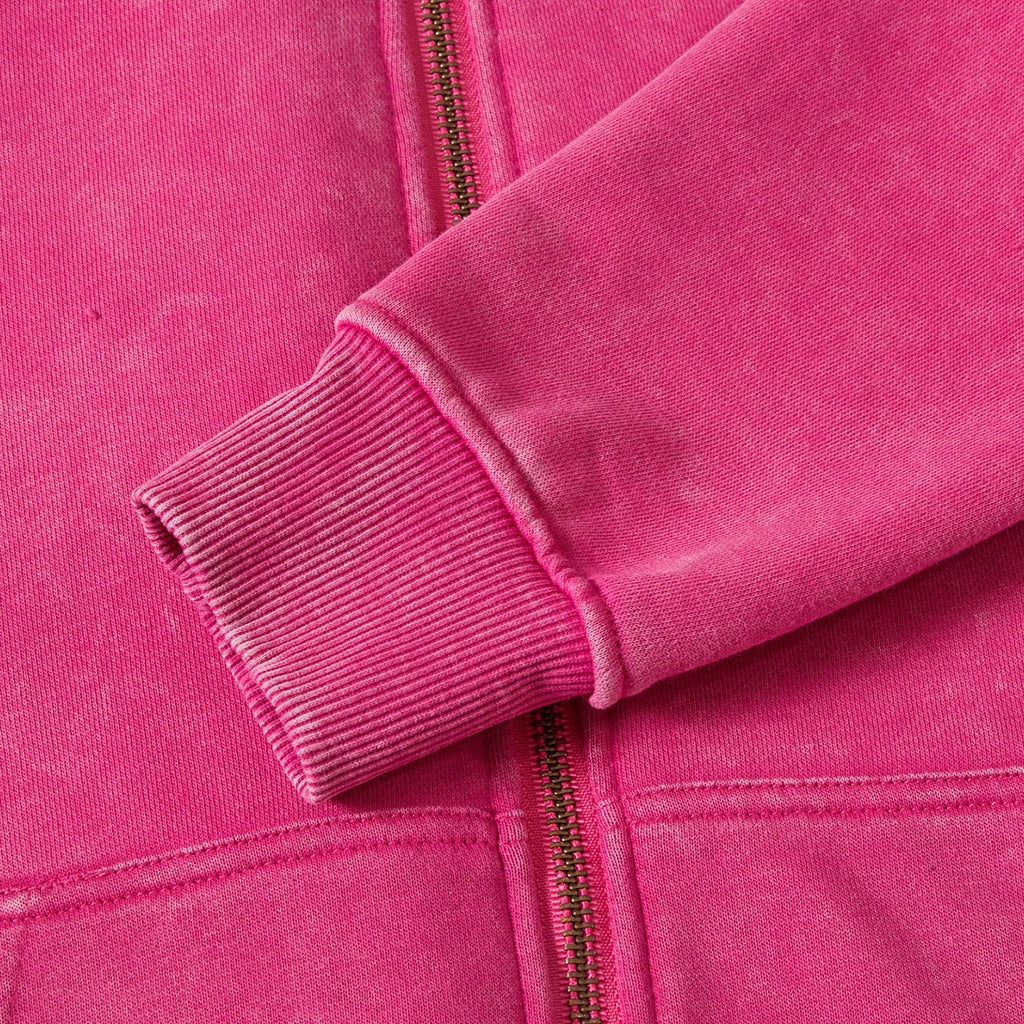 Close-up of a pink jacket with a zipper
