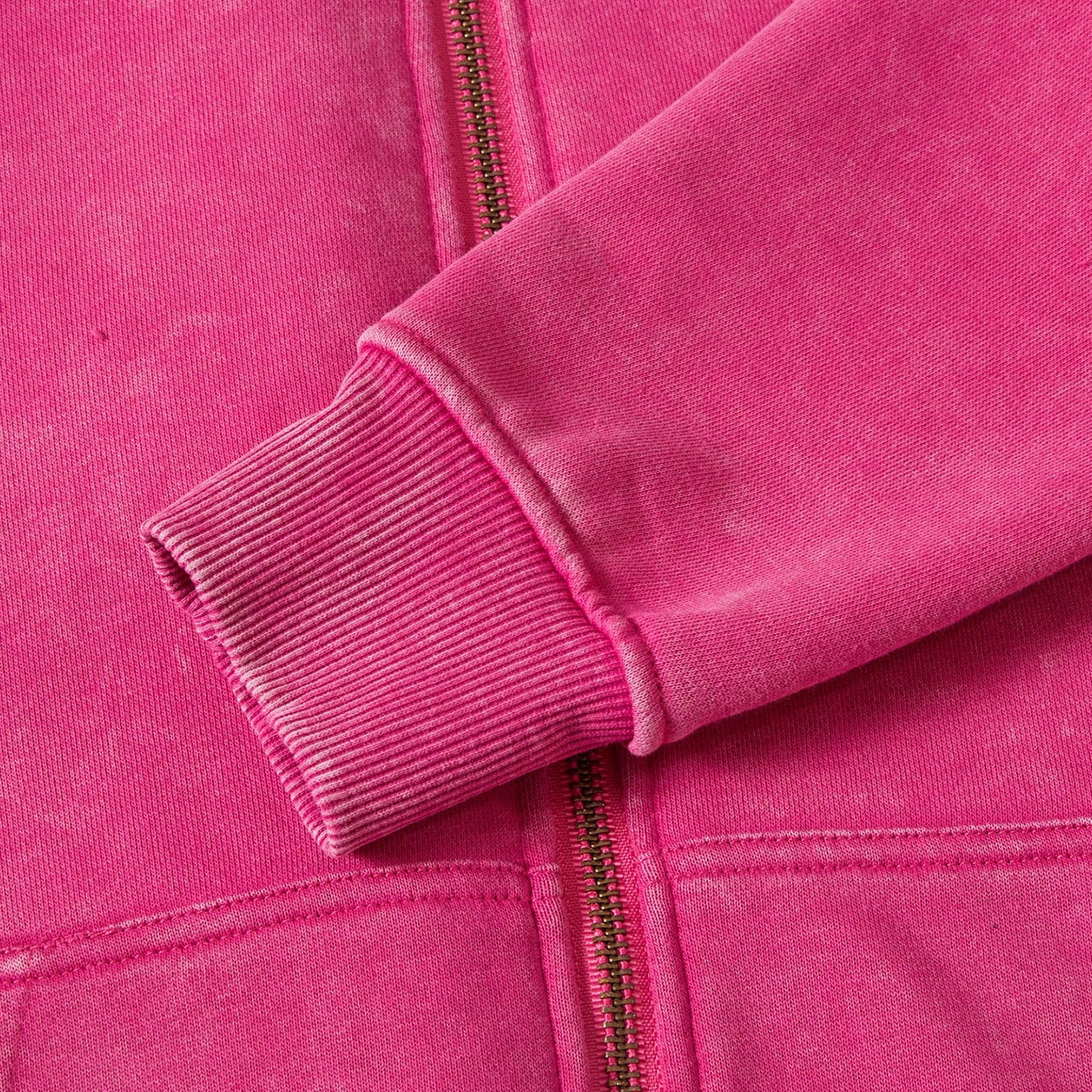 Close-up of a pink jacket with a zipper