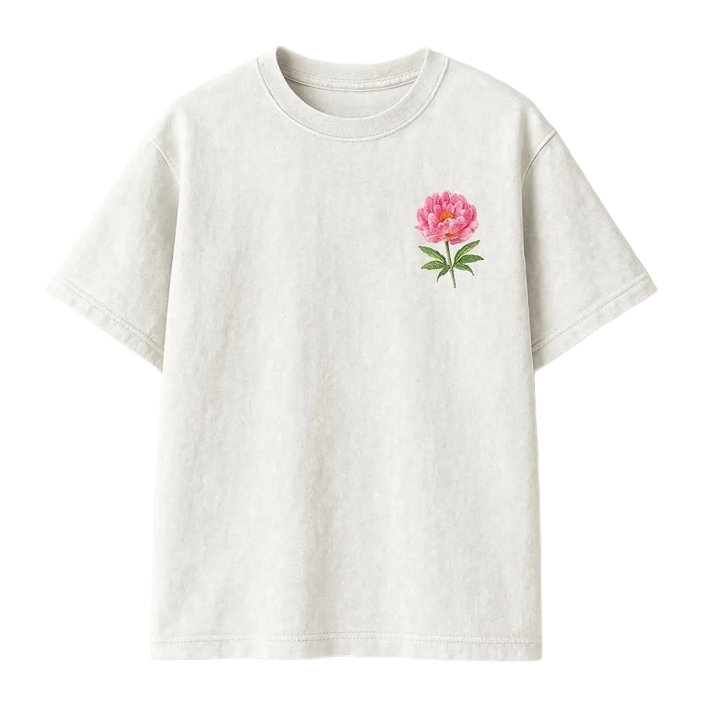 White t-shirt with a pink floral design on a white background